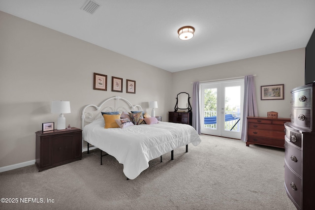 bedroom with visible vents, baseboards, access to outside, and carpet flooring