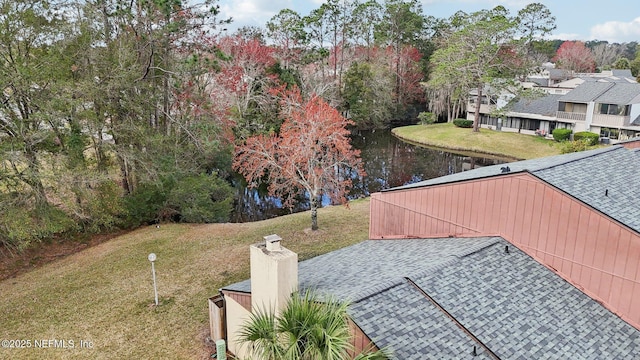 exterior space with a water view