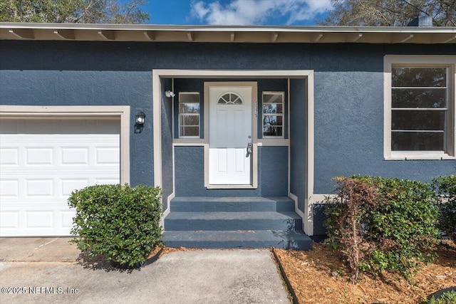 property entrance with a garage