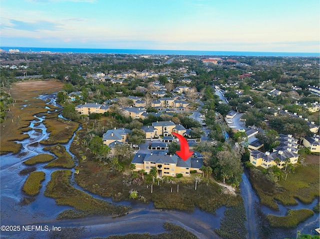 birds eye view of property with a residential view and a water view