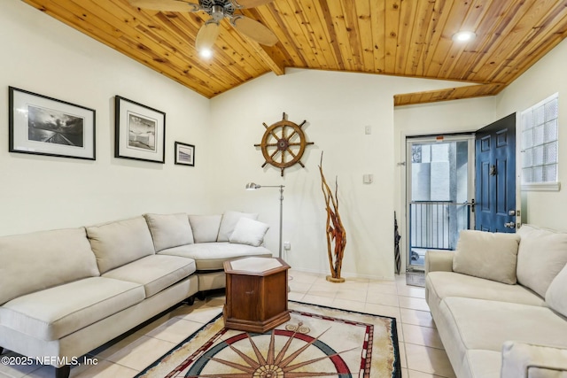 living area with vaulted ceiling with beams, ceiling fan, baseboards, wood ceiling, and light tile patterned floors