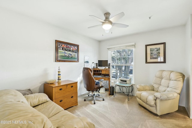 office with light carpet and a ceiling fan