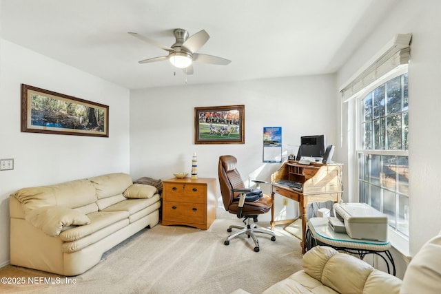 office space with carpet flooring and a ceiling fan