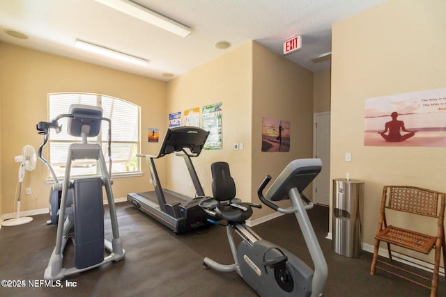 exercise room featuring baseboards