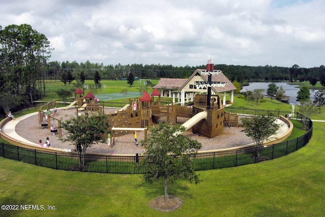 view of playground with a water view and a lawn