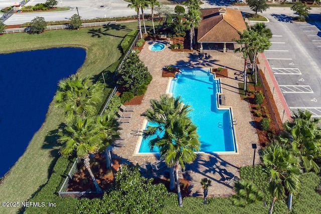 view of swimming pool featuring a water view