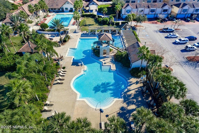 view of swimming pool featuring a patio and a water slide