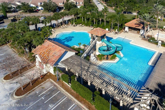 view of swimming pool with a patio area, a gazebo, and a water slide