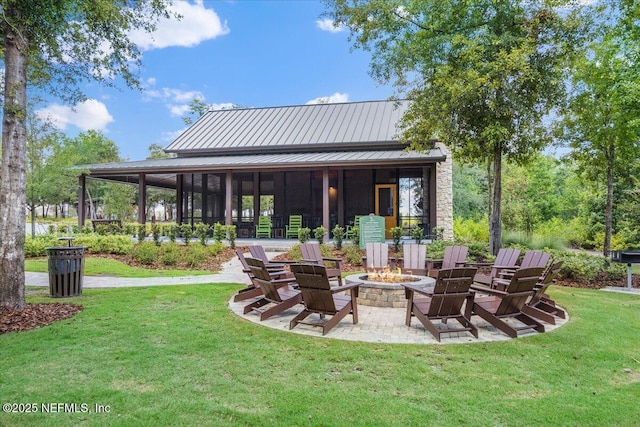 view of patio / terrace with a fire pit