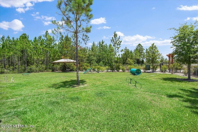 surrounding community with a lawn and fence