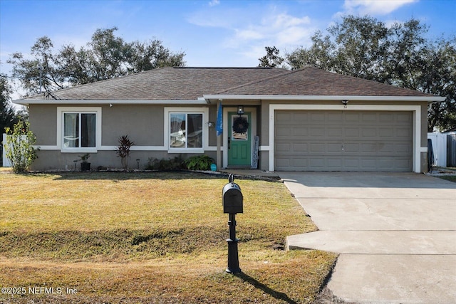 ranch-style home featuring a garage and a front lawn