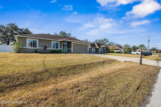 single story home featuring a garage and a front yard