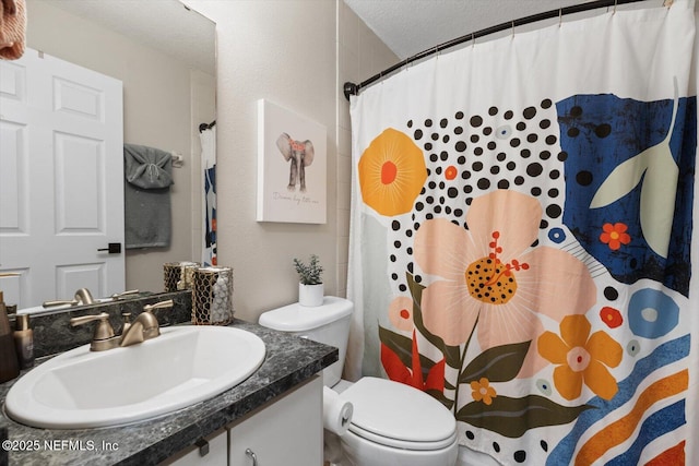 bathroom with vanity, a textured ceiling, toilet, and a shower with shower curtain