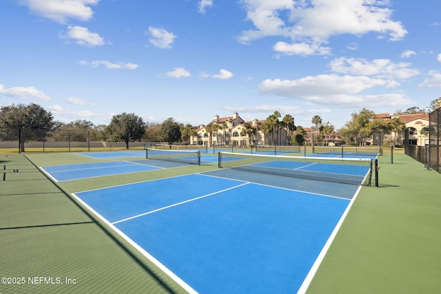 view of tennis court with fence