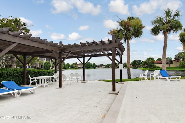 view of patio / terrace with a water view and a pergola