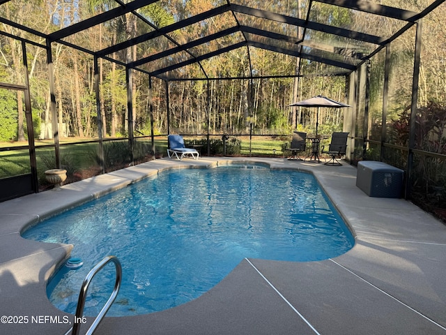 outdoor pool featuring a patio and glass enclosure