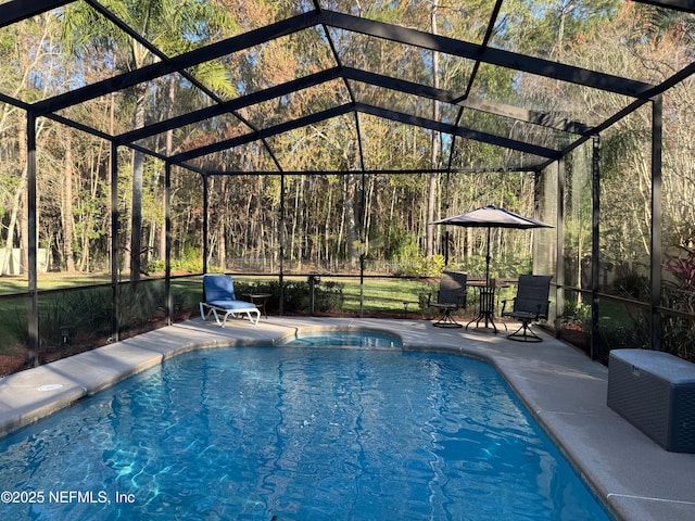 pool featuring a lanai and a patio