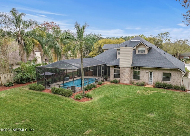 back of house featuring a fenced in pool, brick siding, a yard, a patio area, and a lanai