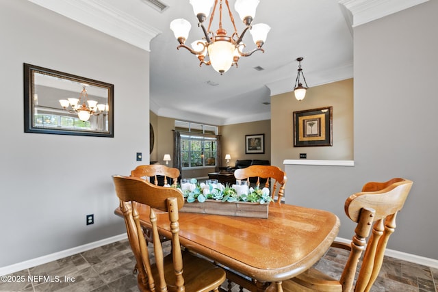 dining room featuring crown molding, baseboards, and an inviting chandelier