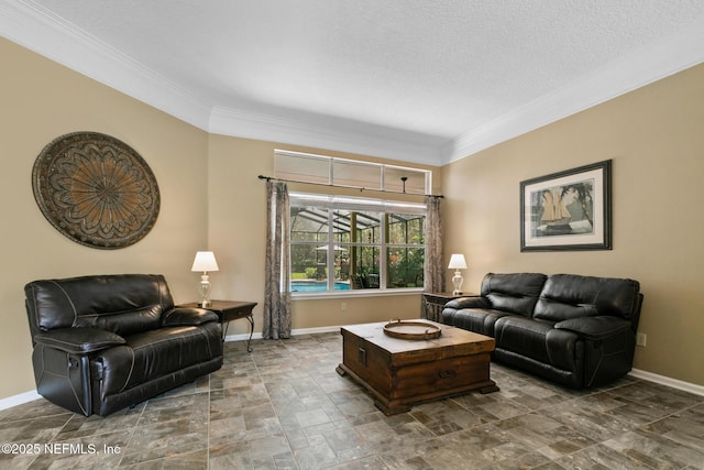 living room featuring baseboards, a textured ceiling, and ornamental molding