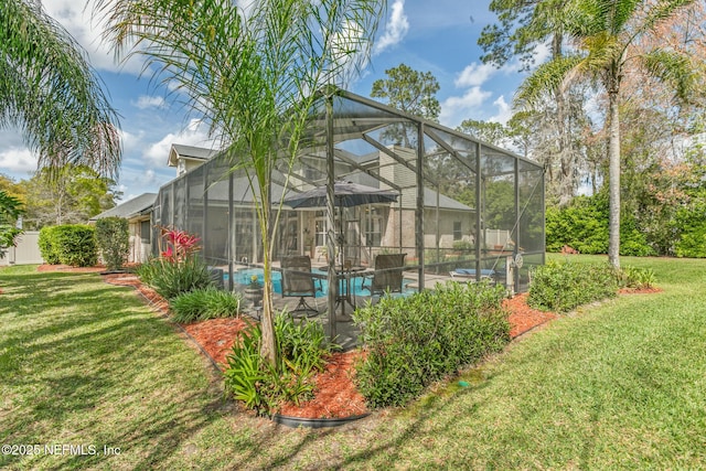 outdoor pool with glass enclosure and a lawn