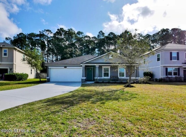 view of front of house with a front yard and a garage