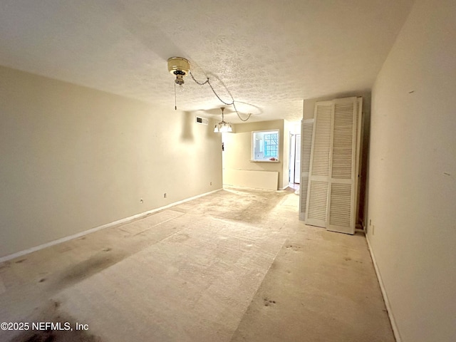 empty room with a textured ceiling