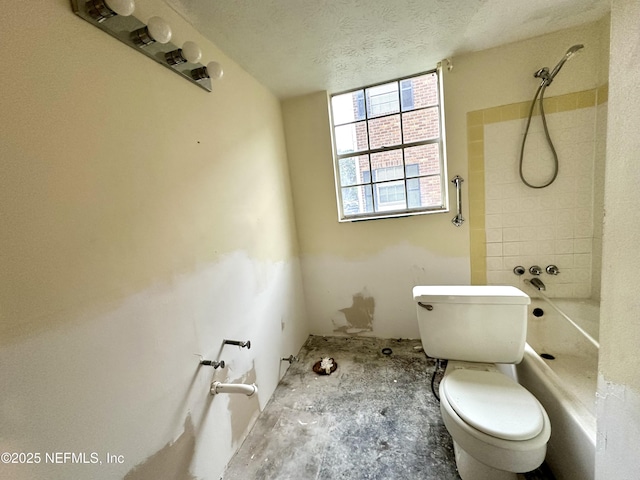 bathroom featuring toilet and a textured ceiling