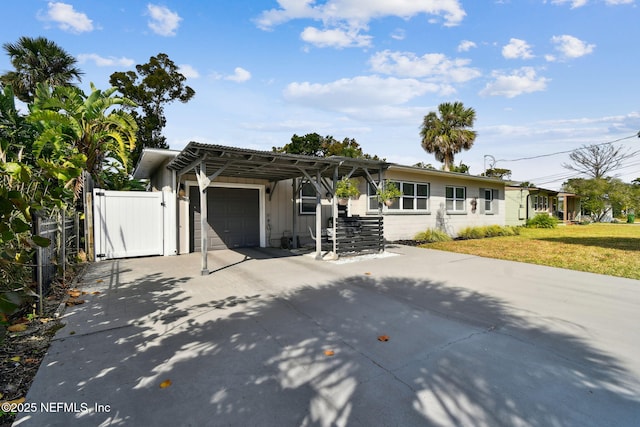 ranch-style home with a front yard and a garage