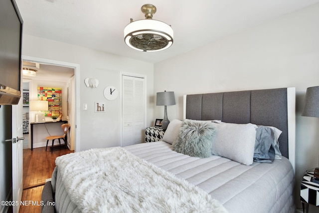 bedroom featuring a closet and dark wood-type flooring