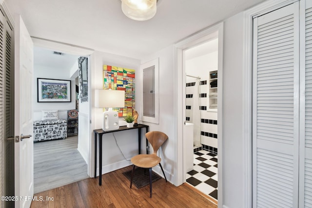 interior space with hardwood / wood-style floors and electric panel