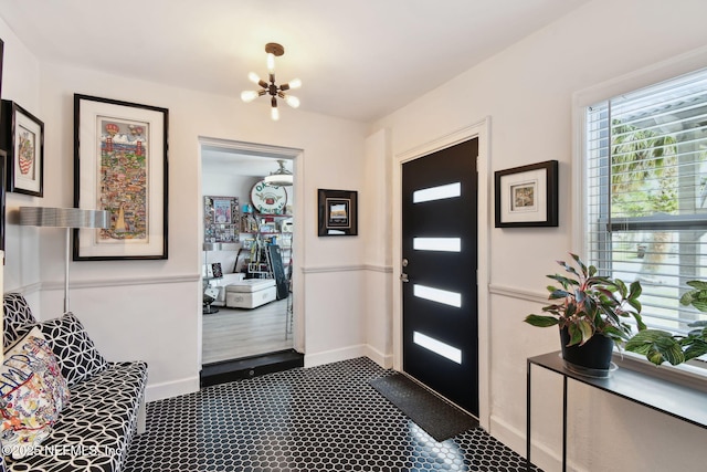 foyer featuring an inviting chandelier