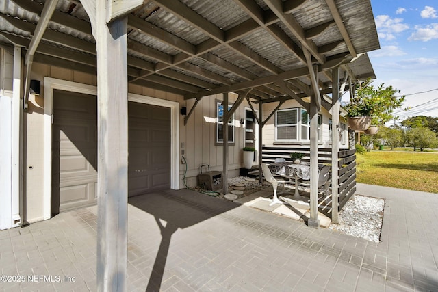 view of patio featuring a garage