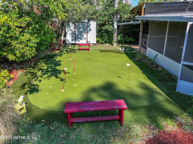 view of yard with a storage shed and an outdoor structure