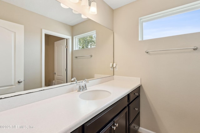 bathroom featuring vanity and baseboards