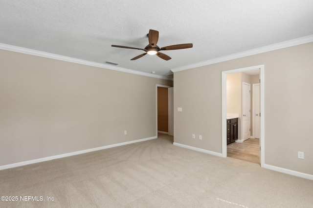 unfurnished bedroom with light carpet, baseboards, visible vents, crown molding, and a textured ceiling