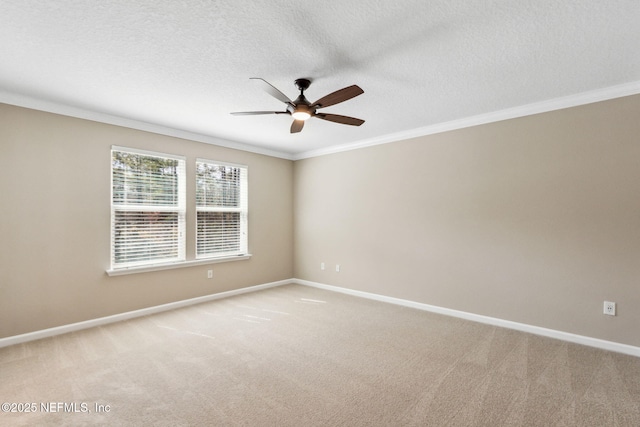 spare room featuring ornamental molding, light colored carpet, and baseboards