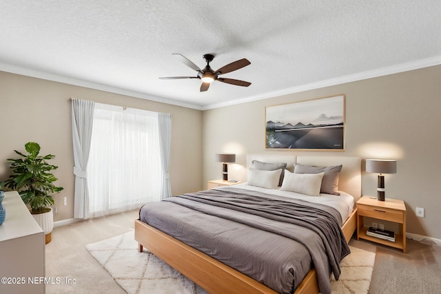 bedroom with crown molding, a textured ceiling, baseboards, and light colored carpet