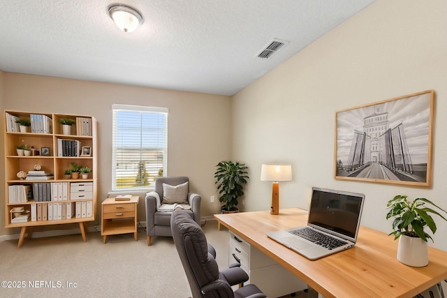 home office featuring visible vents, a textured ceiling, and carpet flooring