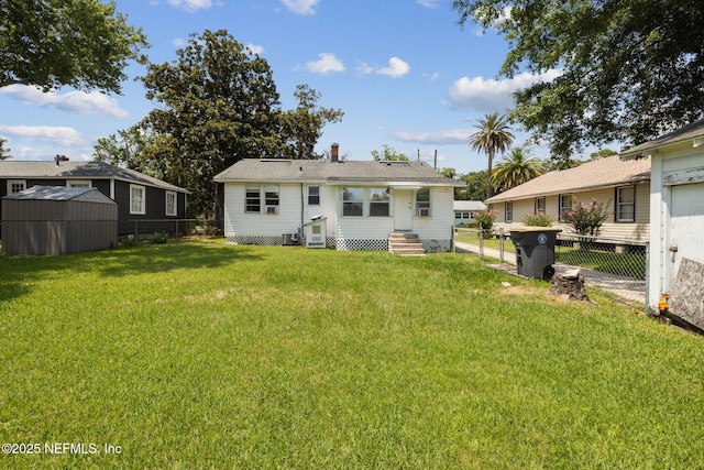 rear view of property with a yard