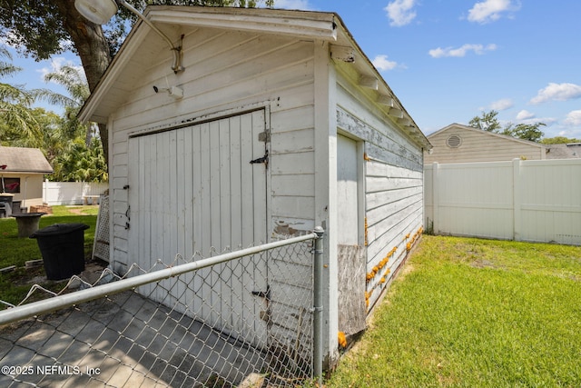 view of outdoor structure with a lawn