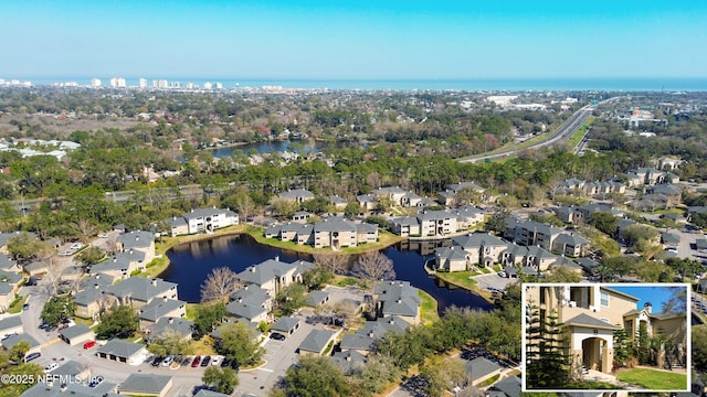 aerial view featuring a water view and a residential view