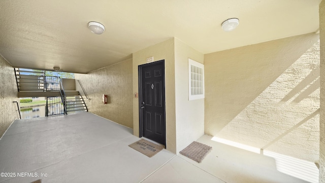 view of exterior entry featuring stucco siding