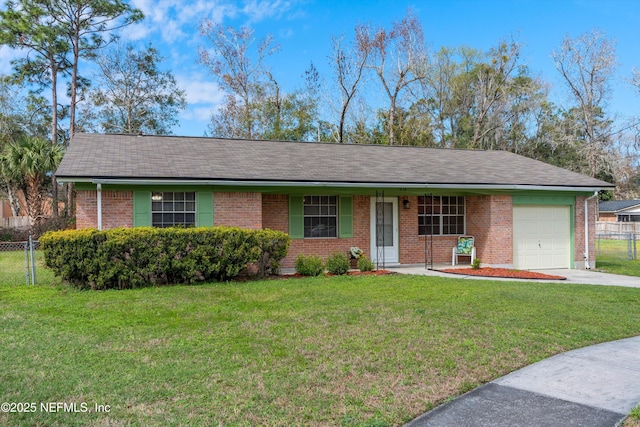 ranch-style home with concrete driveway, brick siding, an attached garage, and a front yard