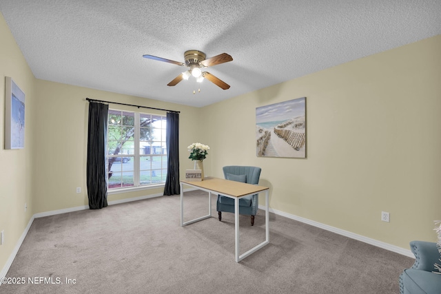 home office with baseboards, a ceiling fan, and carpet flooring