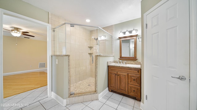 bathroom featuring a stall shower, tile patterned flooring, visible vents, and vanity