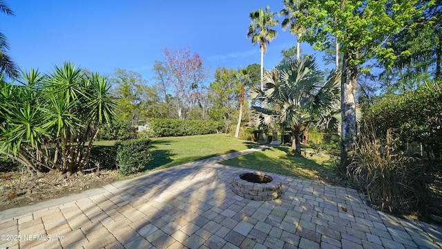 view of patio / terrace featuring an outdoor fire pit