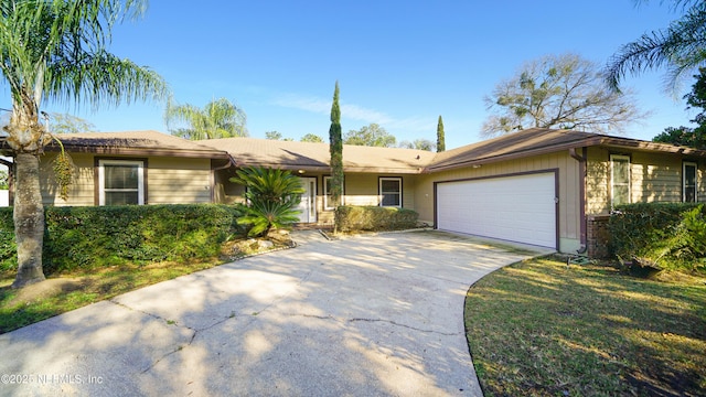 ranch-style house with a garage and driveway