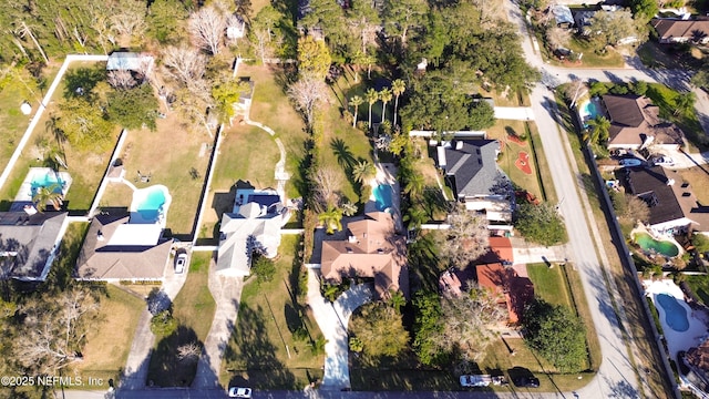 birds eye view of property with a residential view