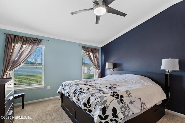 carpeted bedroom featuring multiple windows and ceiling fan